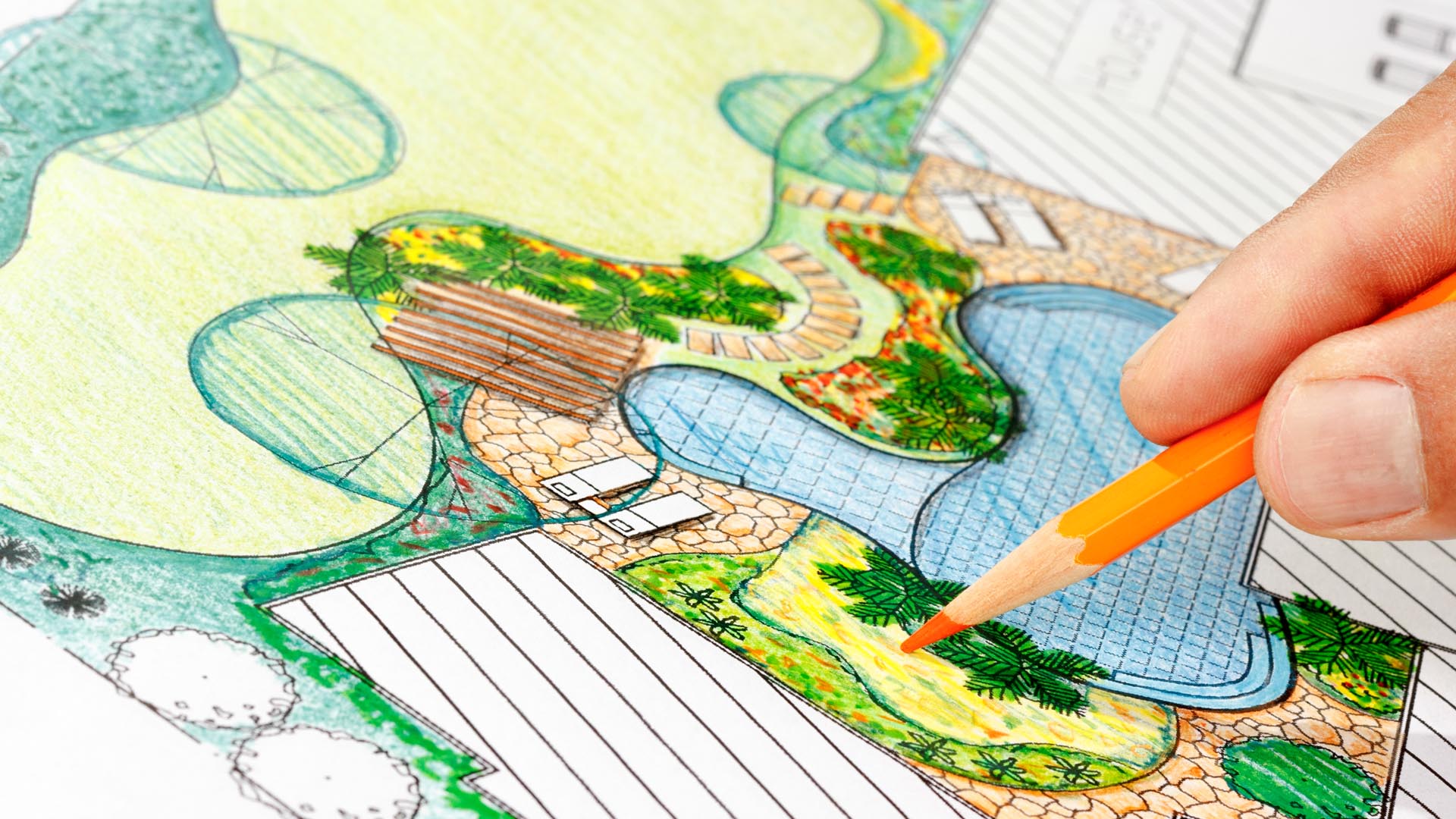 Male shop owner in apron doing paperwork